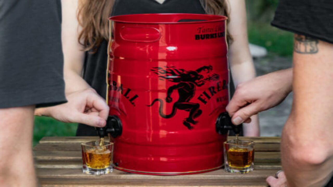 Fireball Whiskey Fire Keg 5.25L with multiple spouts for pouring shots at a gathering.