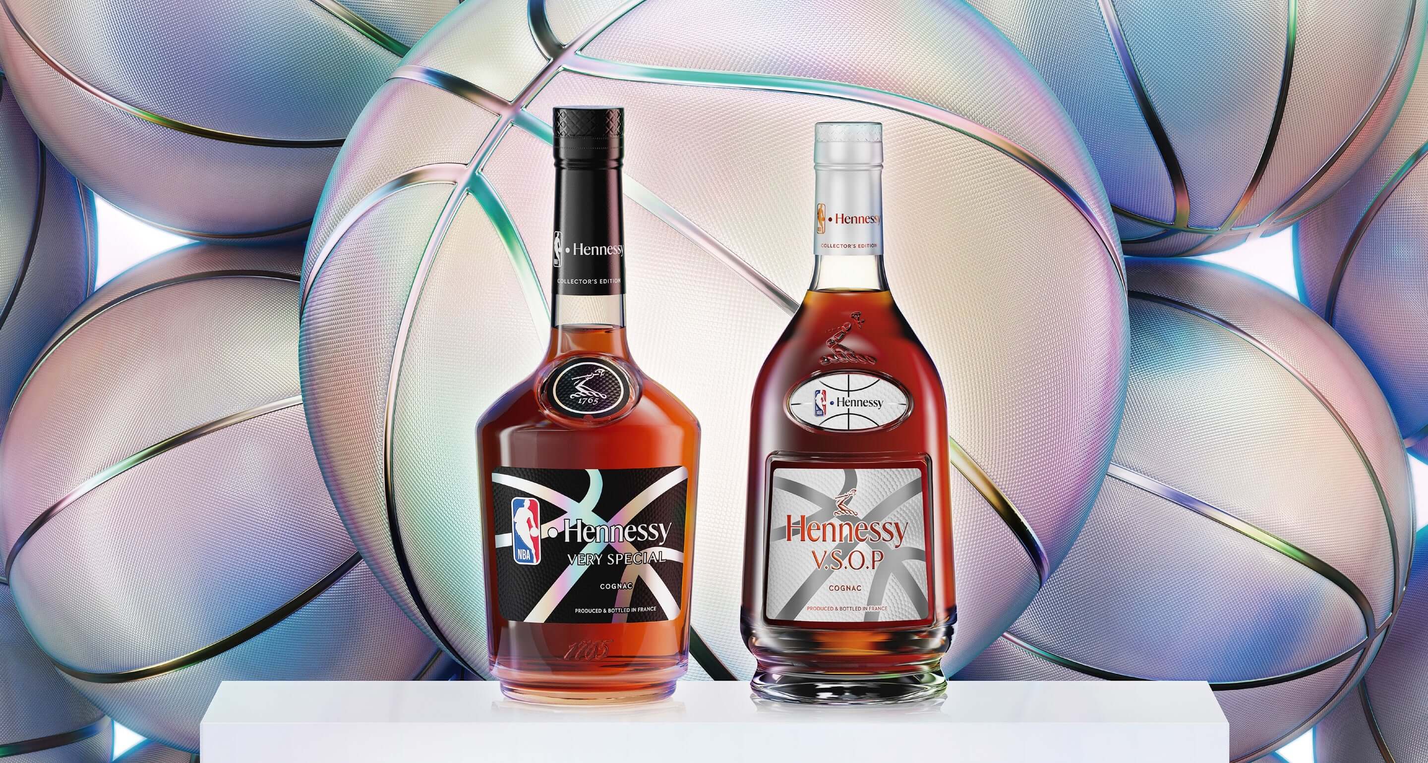 Hennessy Very Special and Hennessy V.S.O.P bottles against a backdrop of vibrant basketballs, celebrating NBA collaboration.