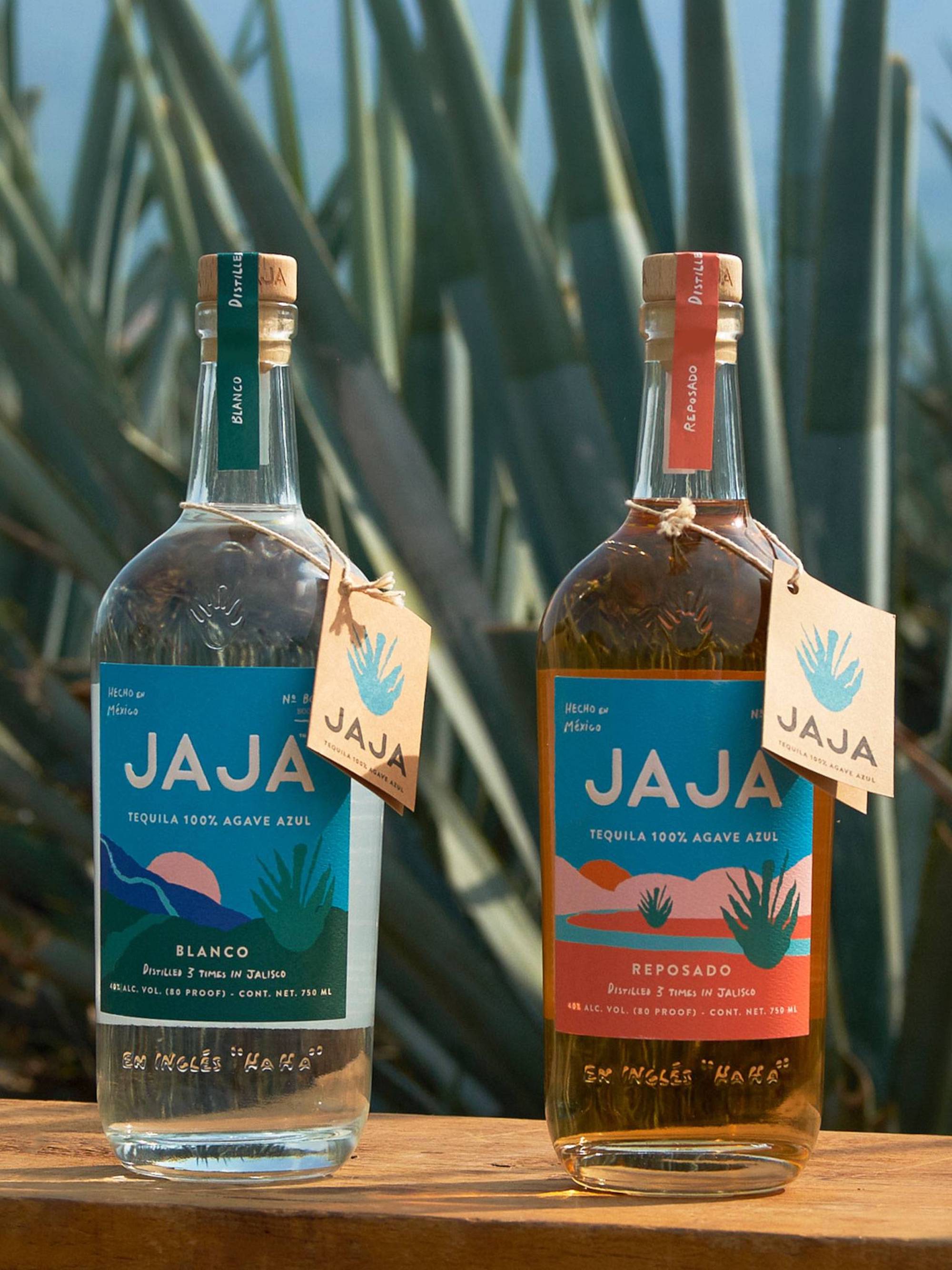 Two bottles of JAJA Tequila, Blanco and Reposado, displayed against an agave plant background.