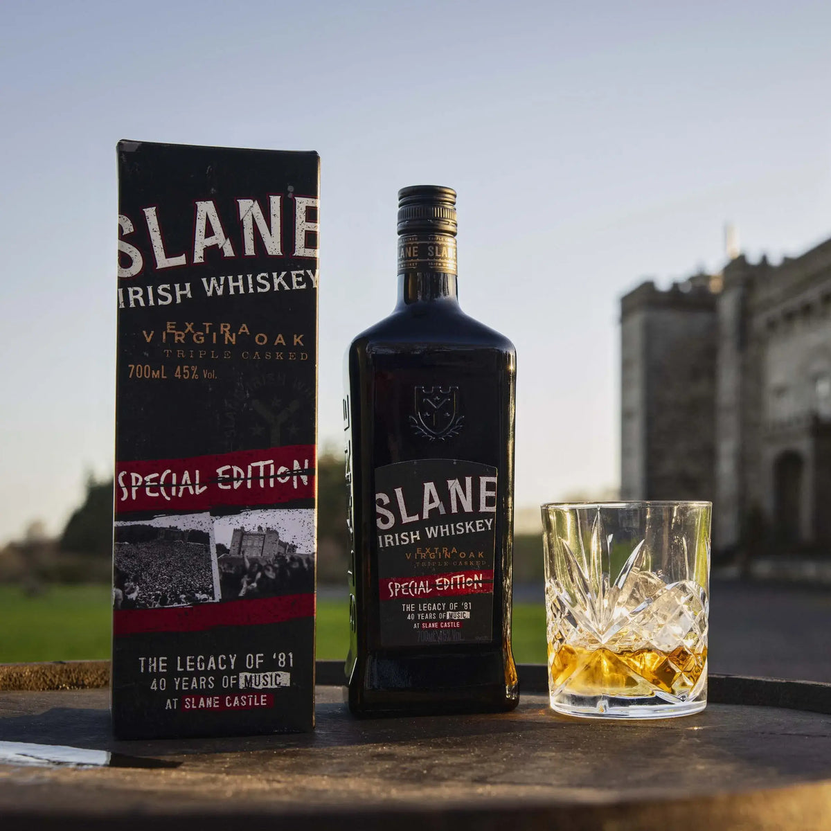 Slane Irish Whiskey Special Edition bottle and glass on display, celebrating 40 years of music at Slane Castle.