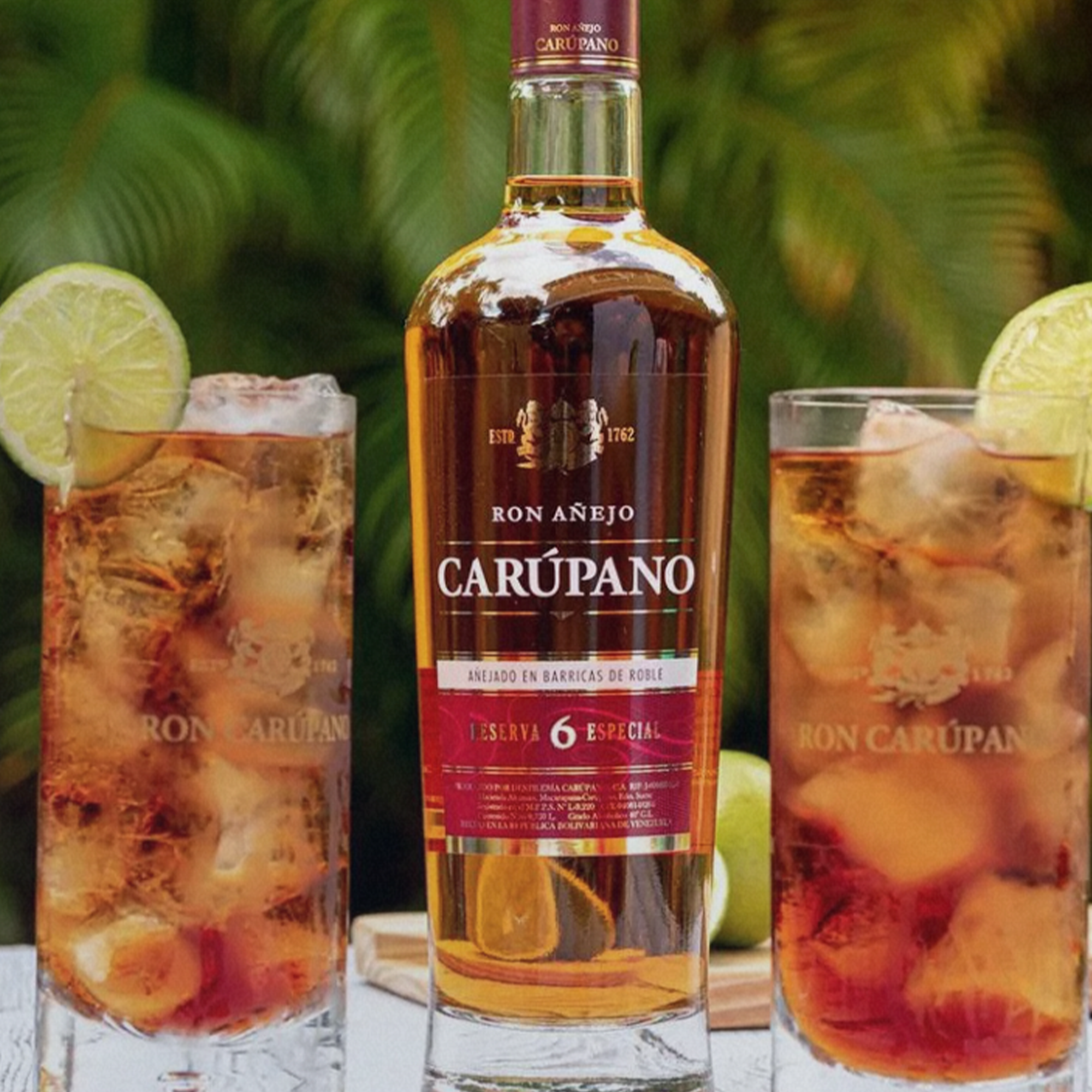 Ron Carupano 6 Year Rum bottle with cocktails, featuring light amber color and lime garnish, perfect for sipping.