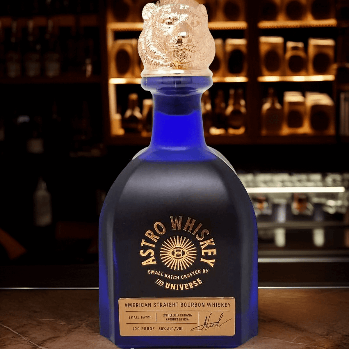 Astro American Straight Bourbon bottle with bear cap, showcasing its unique blue design and intricate label.