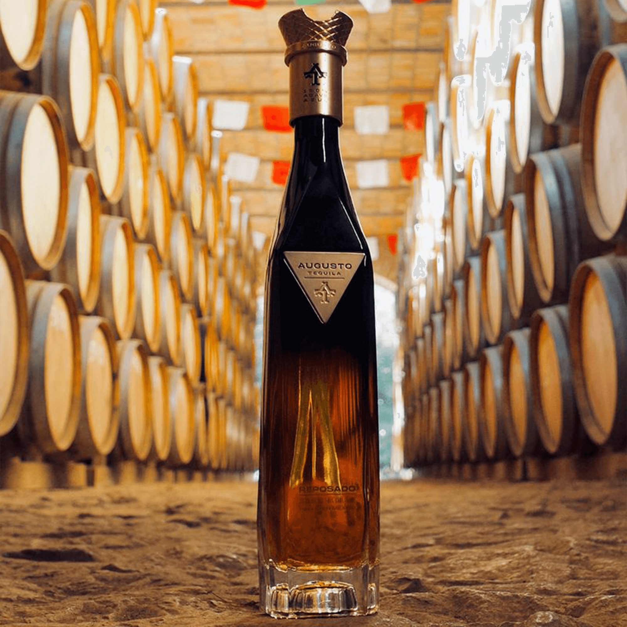 Augusto Sherry Cask Reposado Tequila bottle aged in organic casks, surrounded by wooden barrels.
