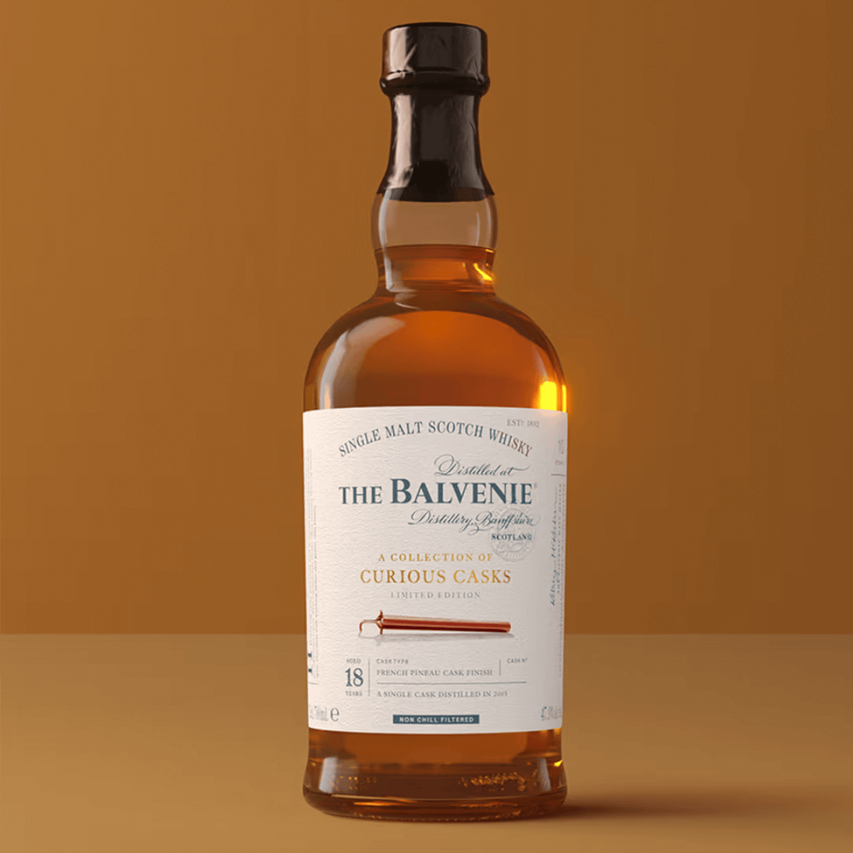 Balvenie 18 Year French Pineau Cask Single Malt Scotch, showcasing elegance and craftsmanship, on a warm background.