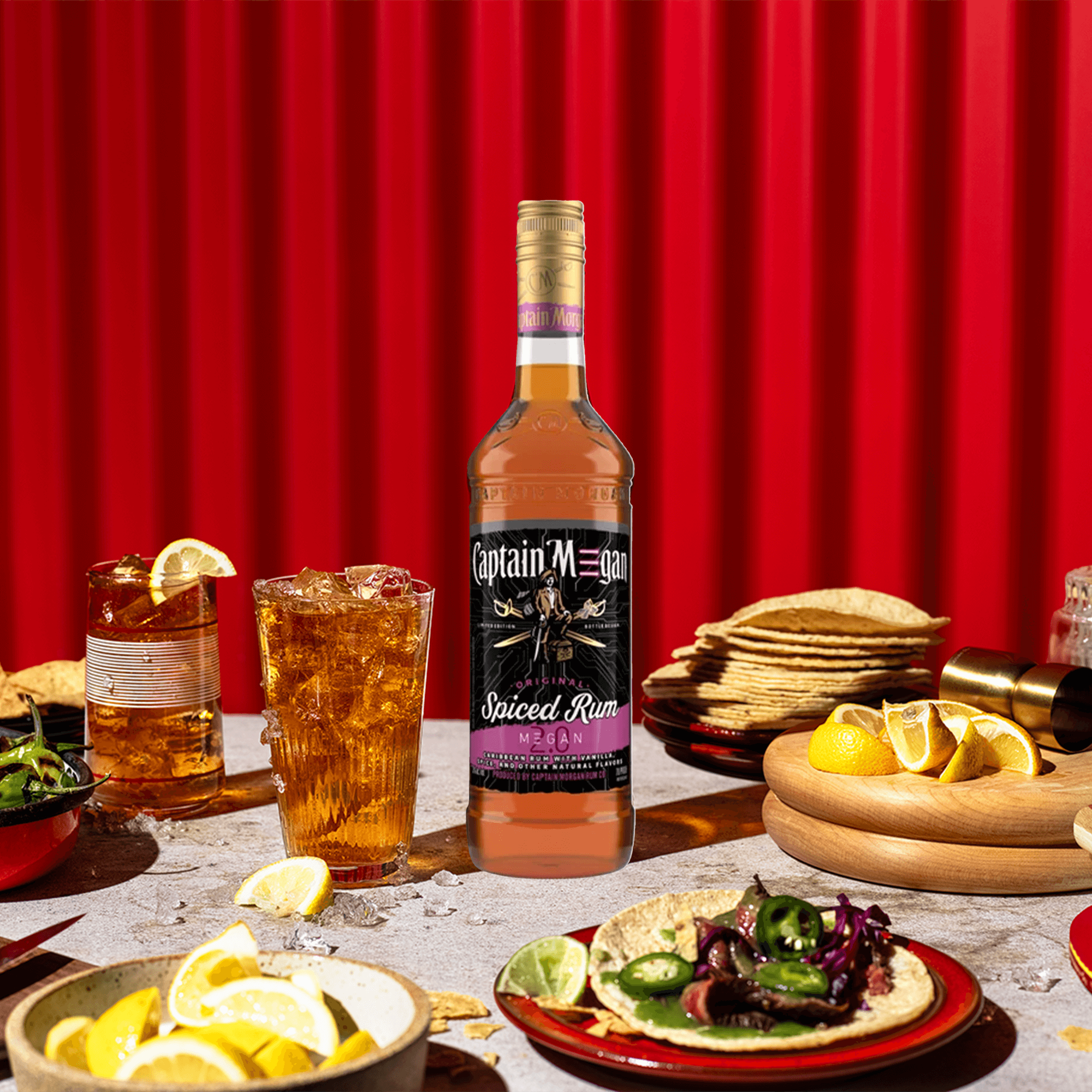 Captain Morgan Limited Edition M3GAN 2.0 Spiced Rum displayed with tacos and drinks on a vibrant red backdrop.