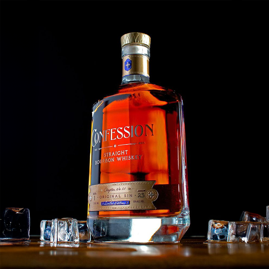 Confession Whiskey Straight Bourbon Chapter No. 1 Limited Edition by Burnt Church Distillery bottle on display with ice cubes.