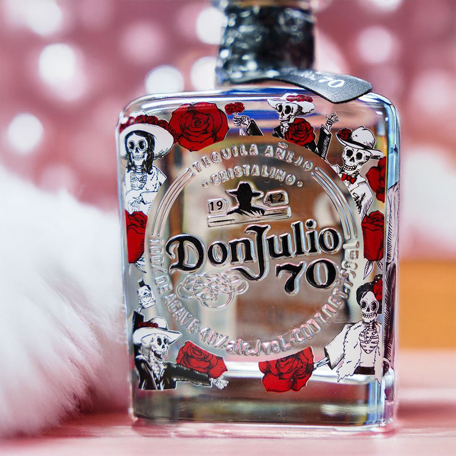 Don Julio 70 Dia De Los Muertos tequila bottle featuring colorful Día de los Muertos designs and roses.