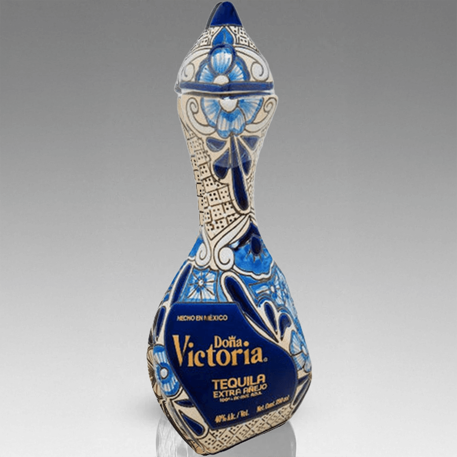 Doña Victoria Extra Añejo Blue Tequila bottle featuring intricate blue and white design.