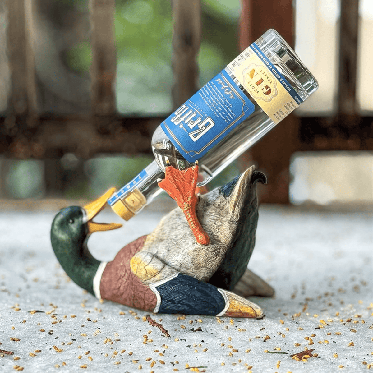 Griffo Scott Street Gin bottle displayed in a decorative duck sculpture, highlighting its unique packaging.