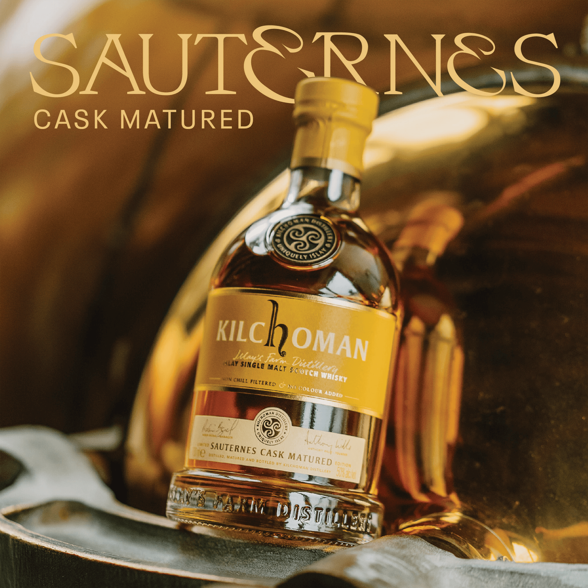 Kilchoman Sauternes Cask Matured 2024 Whisky bottle with elegant label and golden background.
