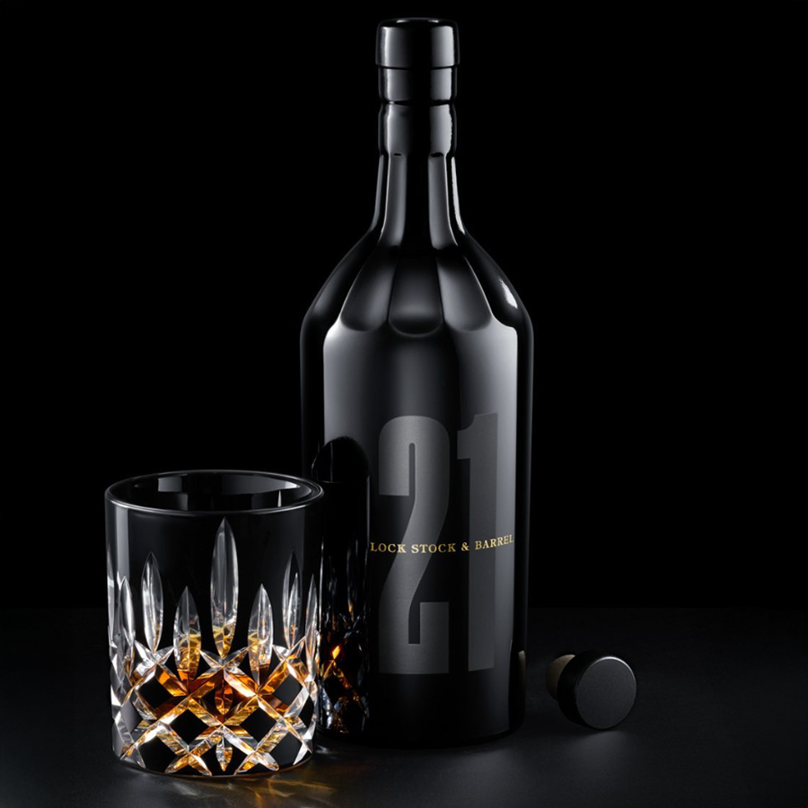 Lock Stock & Barrel 21 Year Straight Rye Whiskey bottle and glass with whiskey, elegantly displayed against a dark background.