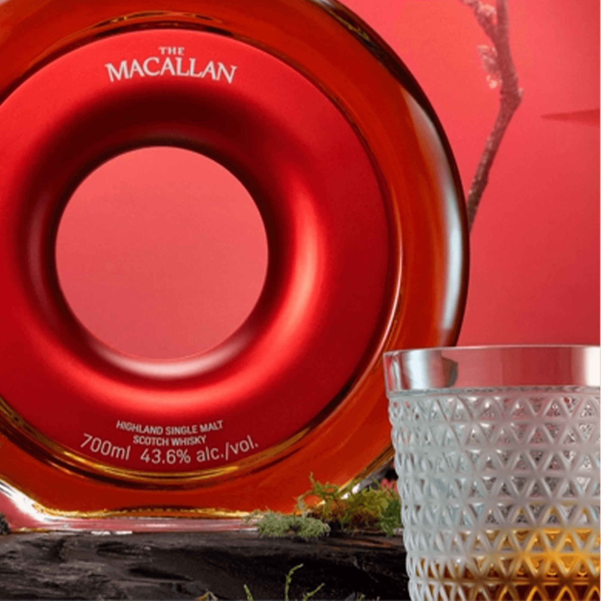 Macallan Time Space Mastery Single Malt Scotch Whisky 700ml in a circular vessel with a glass tumbler.