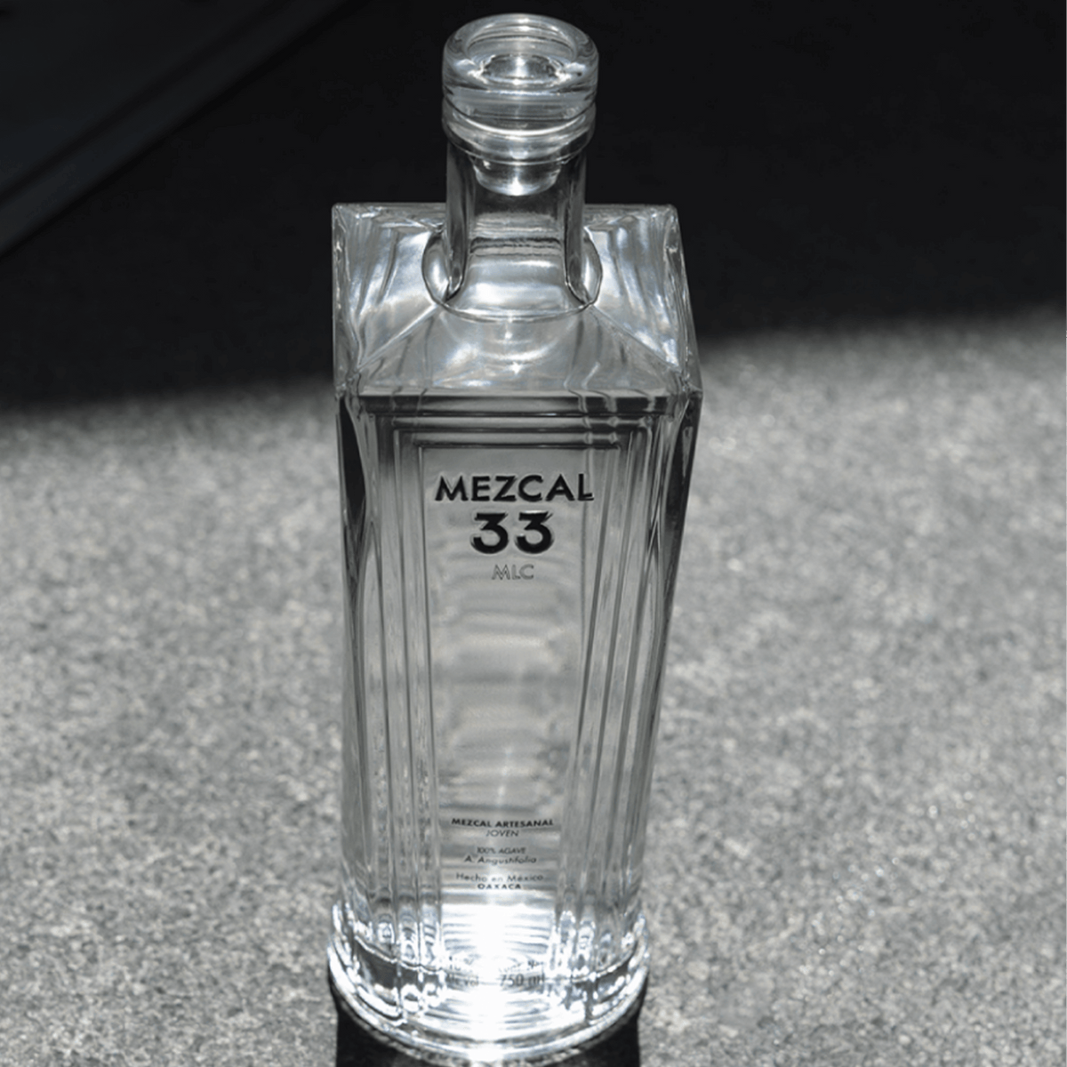 Bottle of Mezcal 33 Joven Espadin showcasing a sleek design and premium craftsmanship.