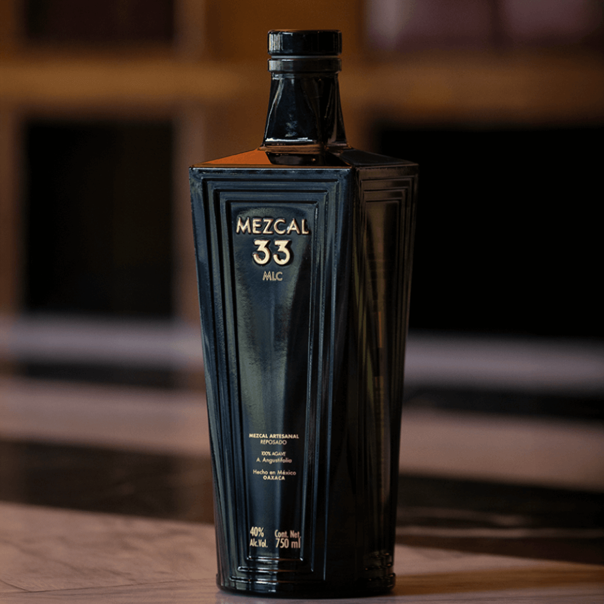 Mezcal 33 Reposado Espadin bottle showcasing elegant design and 40% ABV, perfect for sophisticated mezcal experiences.