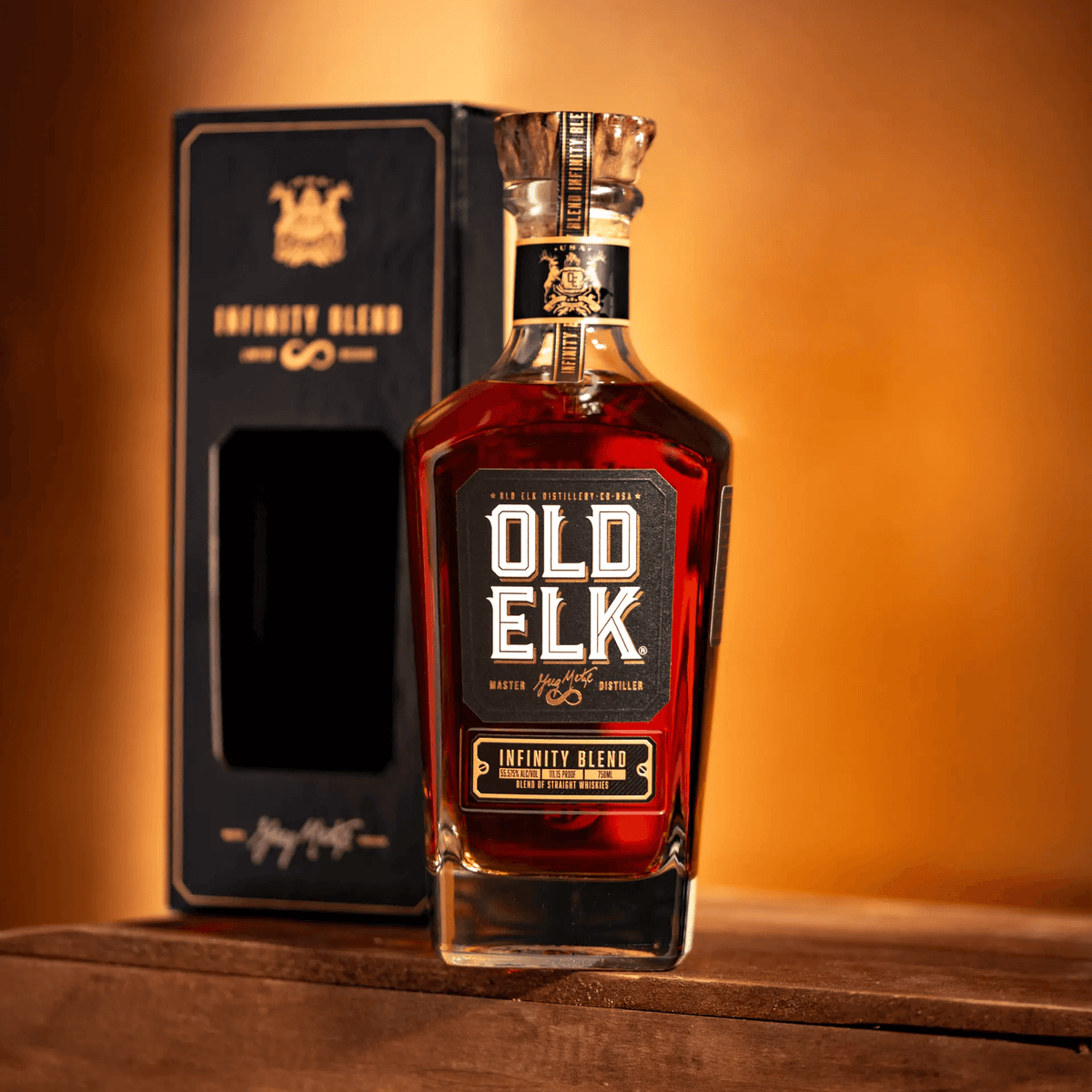 Old Elk 2023 Infinity Blend Whiskey bottle with elegant packaging on a wooden surface.