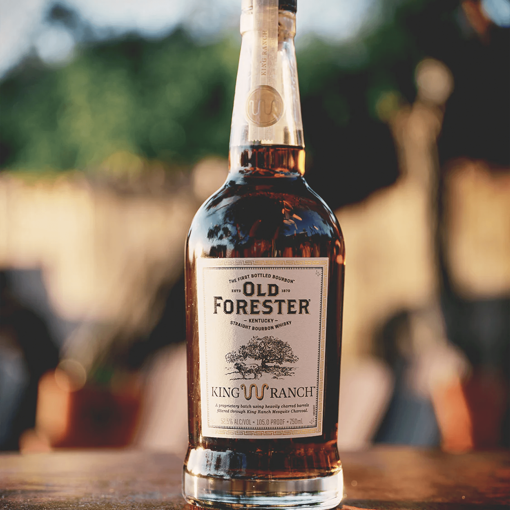 Old Forester King Ranch Edition Bourbon bottle with a natural background, highlighting its rich color and design.