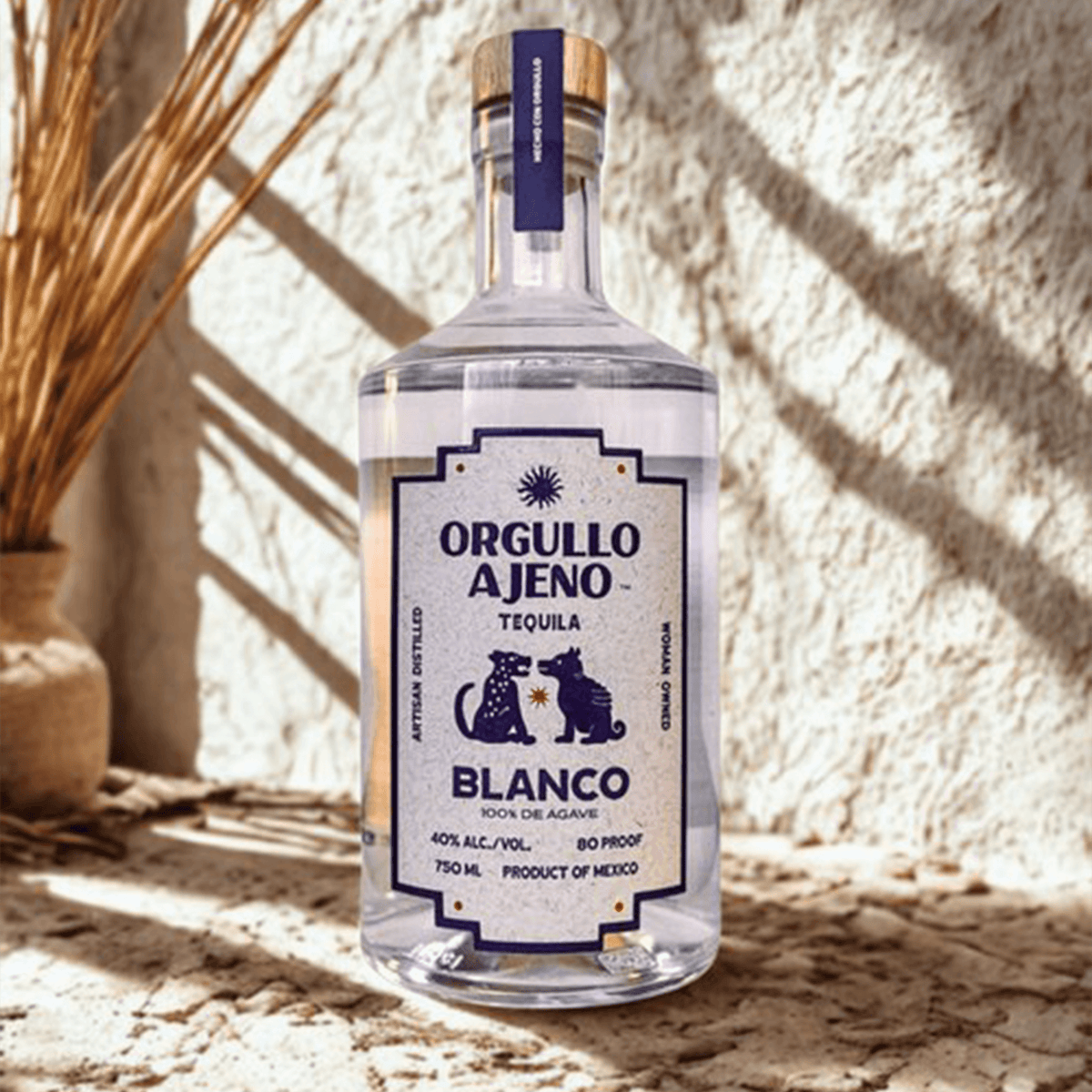 Bottle of Orgullo Ajeno Blanco Tequila, crafted from 100% blue Weber agave, showcasing vibrant Mexican spirit.