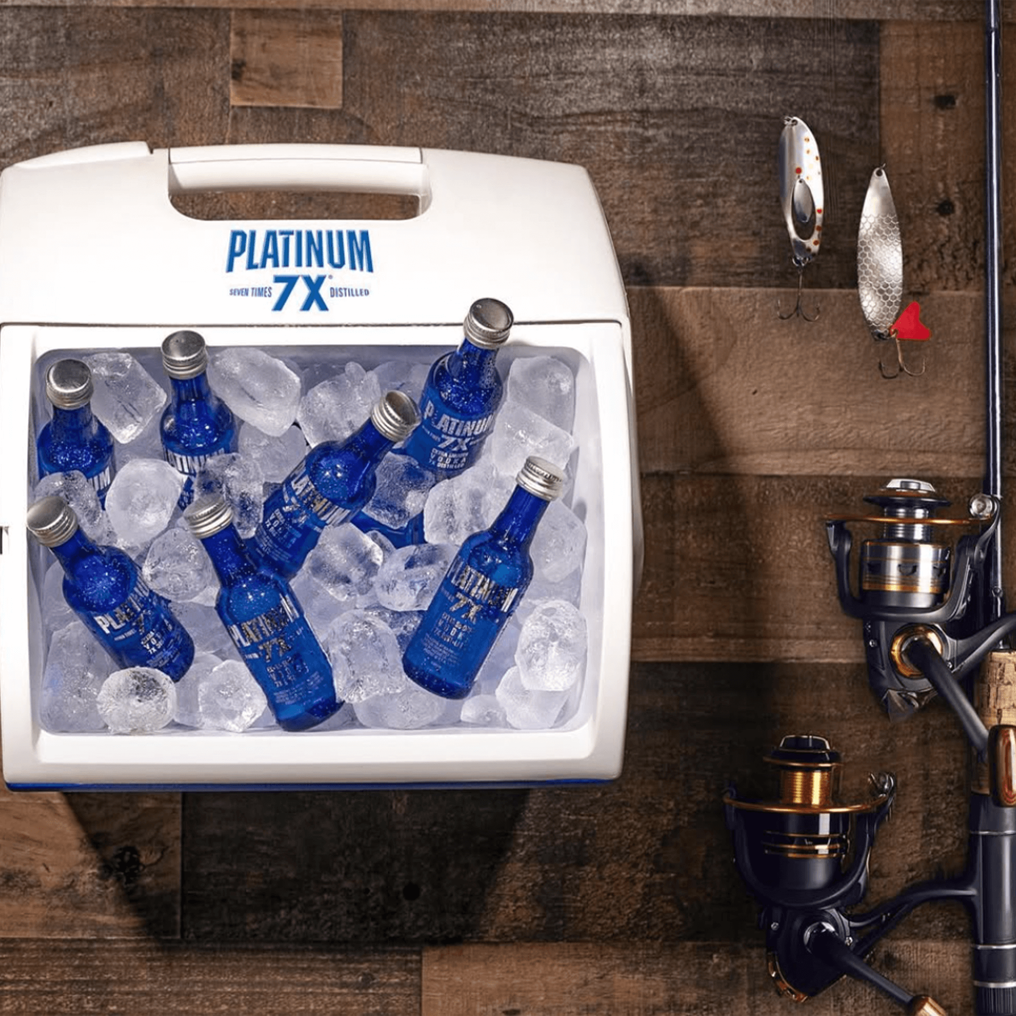 Platinum 7X Vodka bottles in a cooler filled with ice, ideal for fishing adventures and outdoor gatherings.
