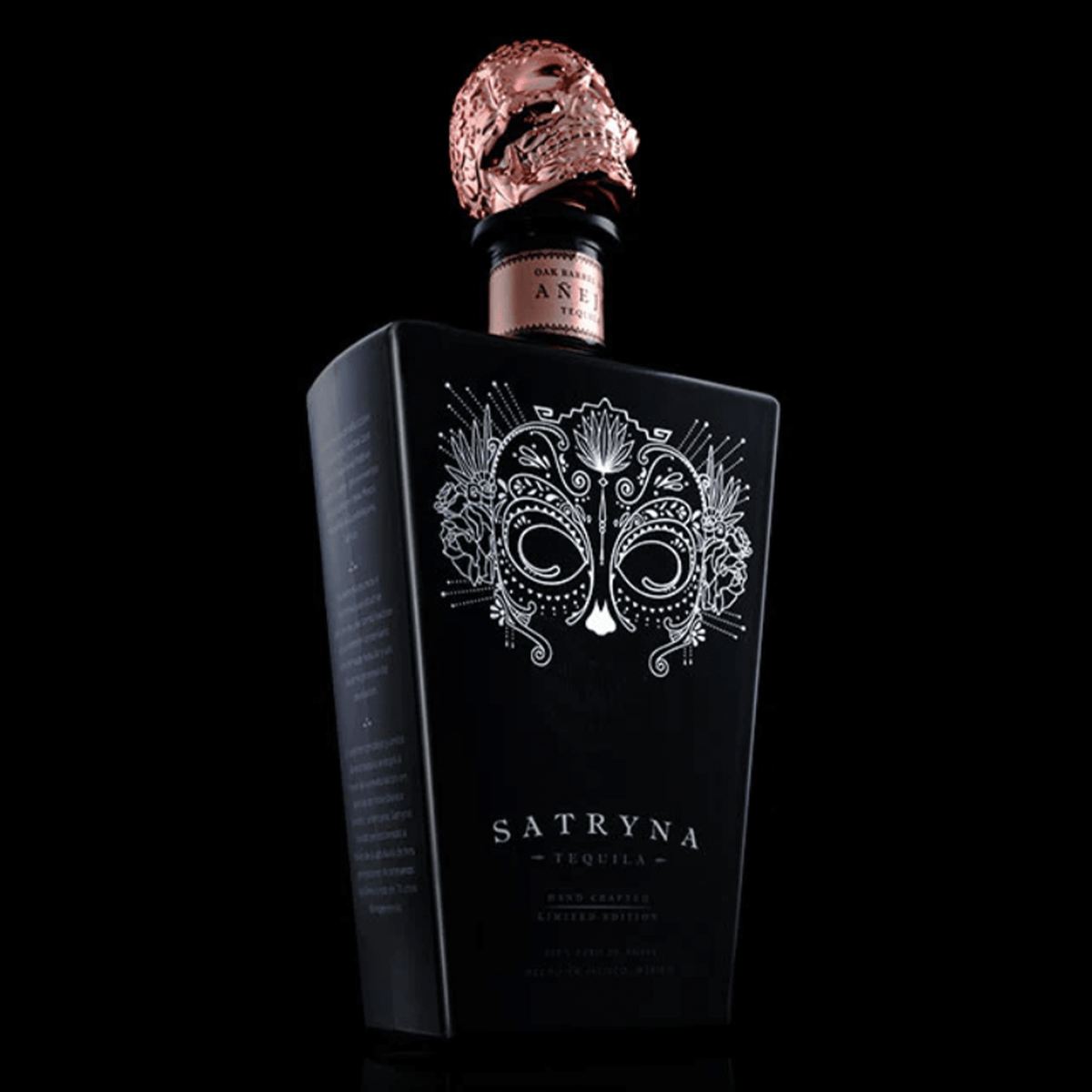Elegant Satryna Añejo Tequila bottle with intricate design and artistic cork, highlighting artisan craftsmanship.