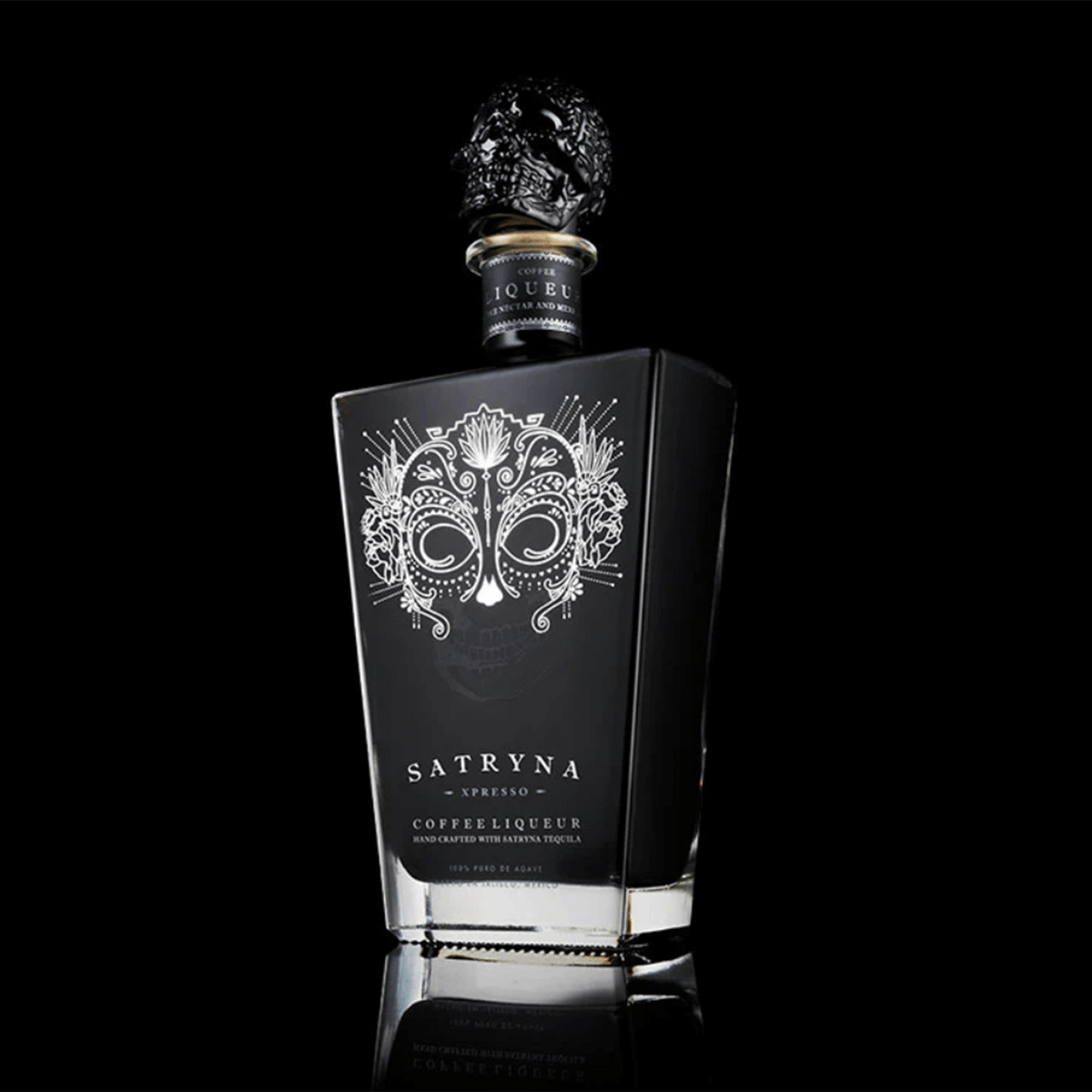 Satryna Xpresso coffee tequila liqueur bottle with intricate design, showcasing sleek black packaging and skull cap.