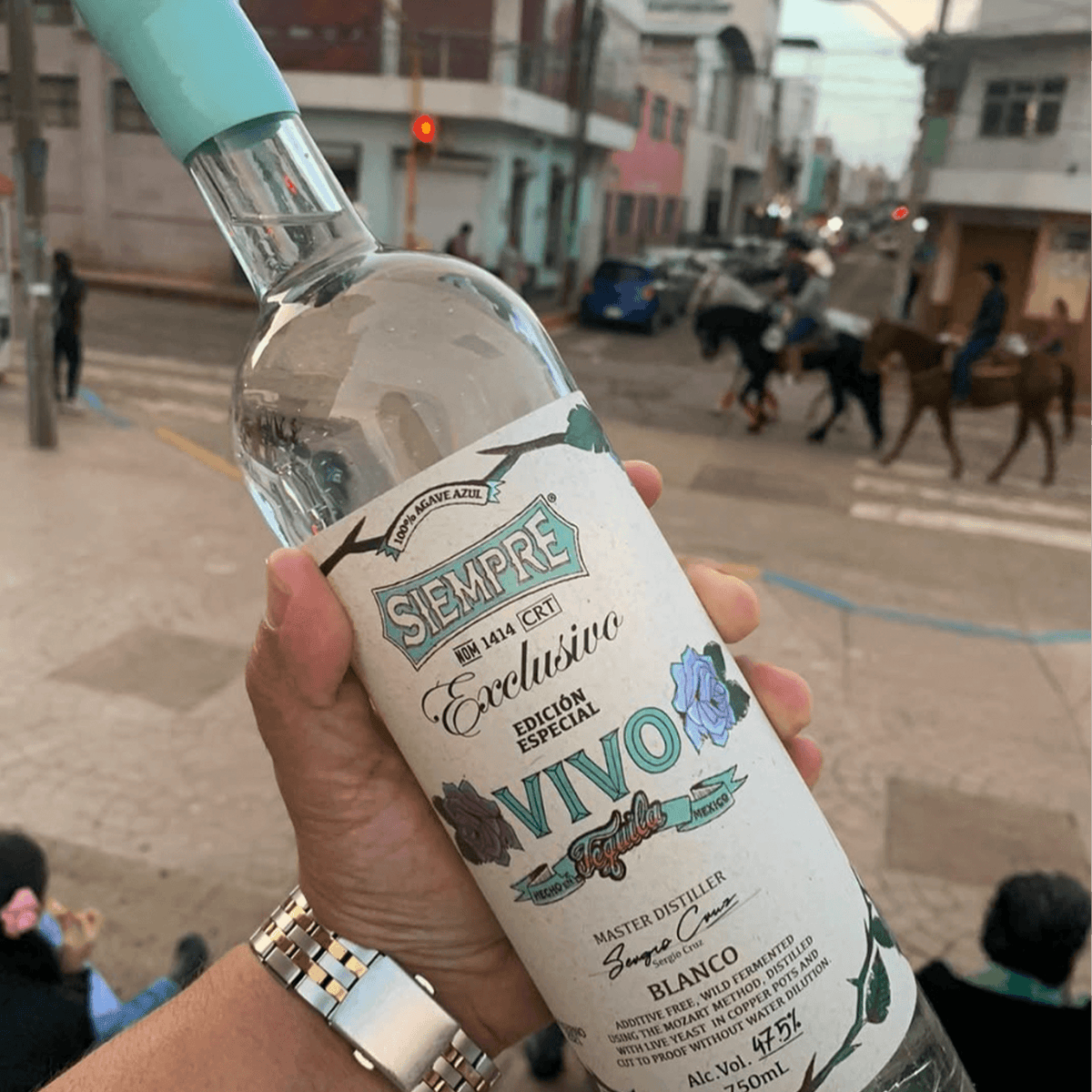 Siempre Edition Especial Vivo Blanco Tequila bottle held in hand, showcasing unique design and craftsmanship.