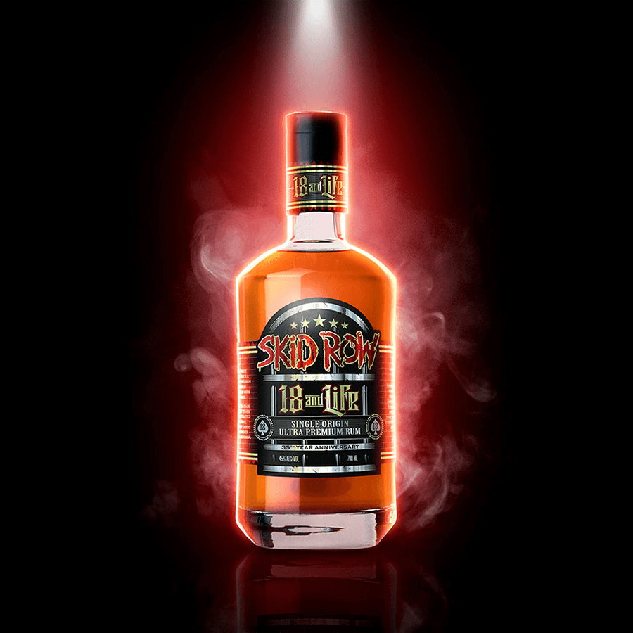 Bottle of Skid Row 18 and Life Ultra Premium Rum showcasing bold design and rich amber color.