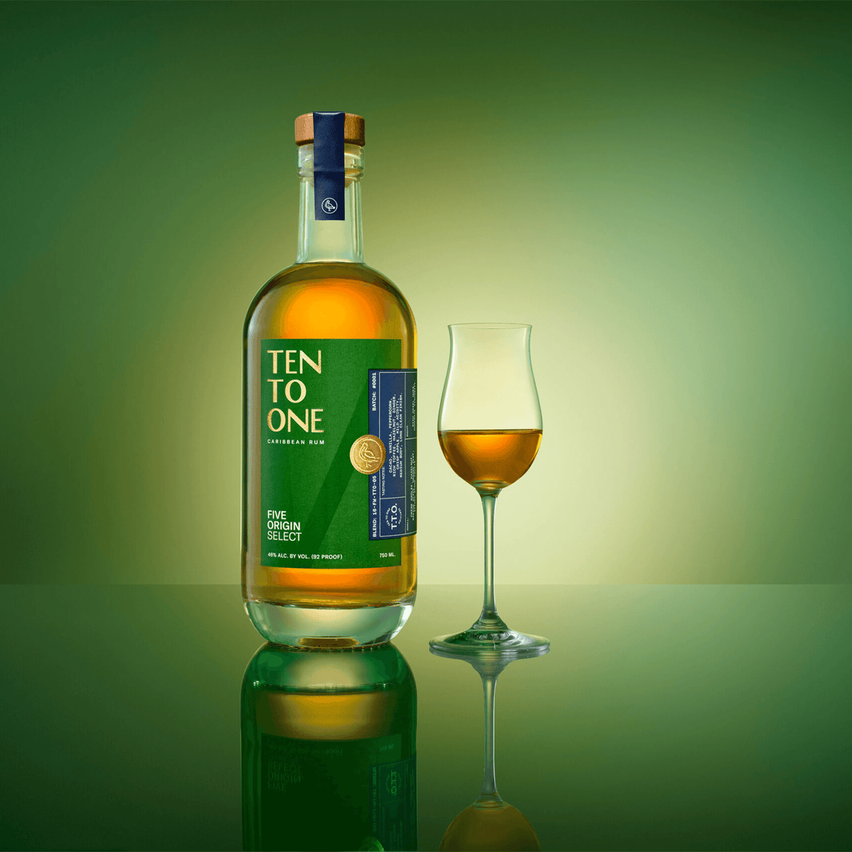 Bottle of Ten To One Five Origin Select Rum with a glass, set against a green background.