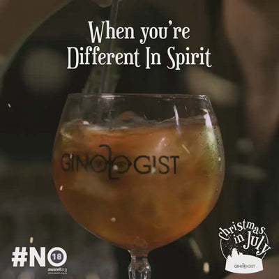 A cocktail with Ginologist branding, evoking festive spirits during Christmas in July.
