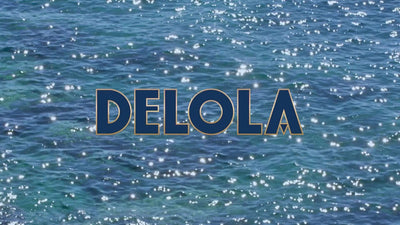 Delola brand logo over sparkling blue ocean water, symbolizing refreshing ready-to-drink spritzes.