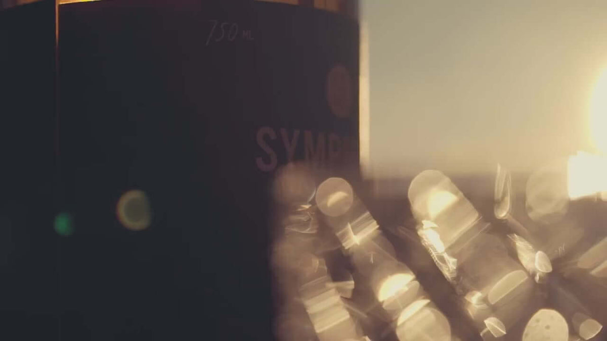 Bottle of Symphony No.3 Aged Rum with soft sunlight reflecting on the glass, showcasing its luxurious essence.